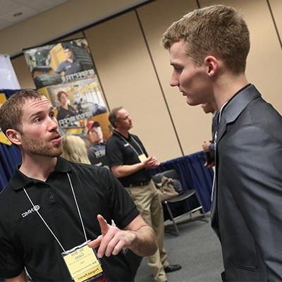 a student talks with an employer at the ID Career Event